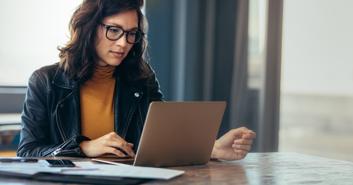asian woman working on laptop 