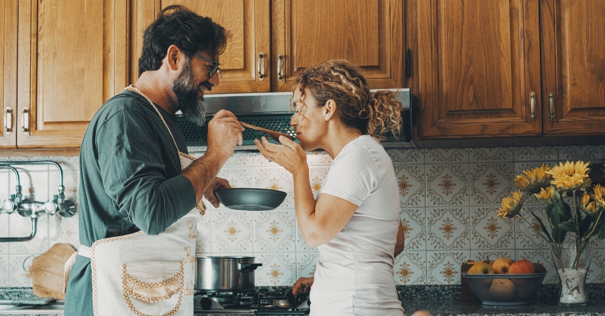 husband cooking for his wife