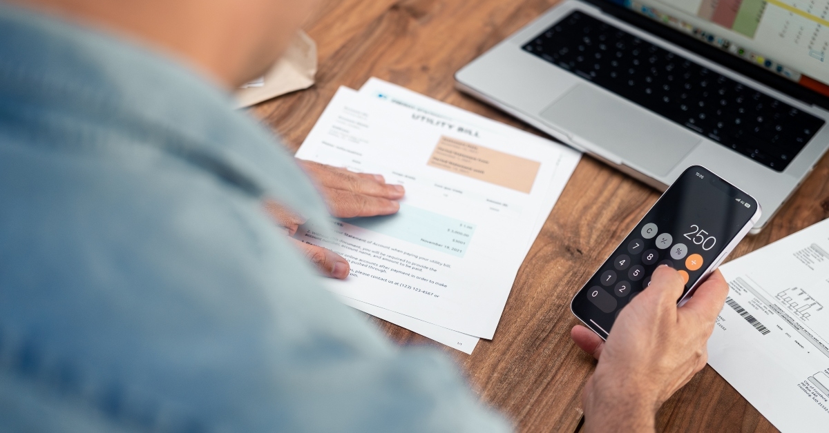 man using a smartphone calculator