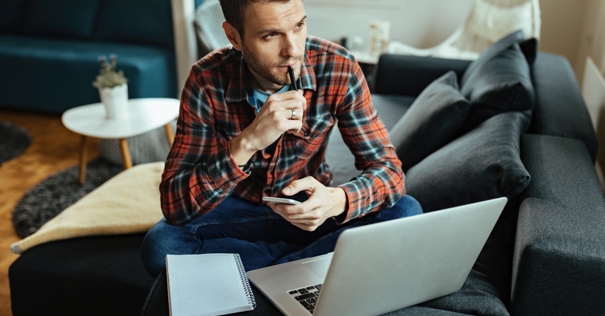 pensive man working at home