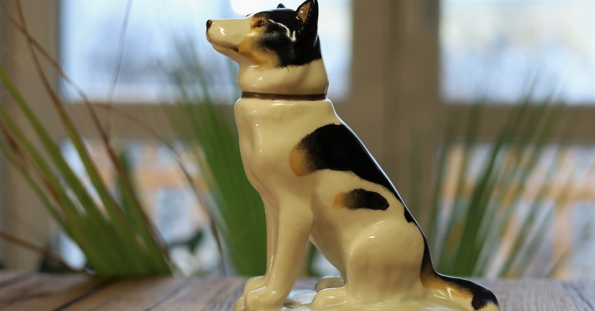 Sitting dog porcelain figurine