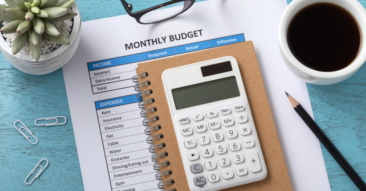 monthly budget with white calculator