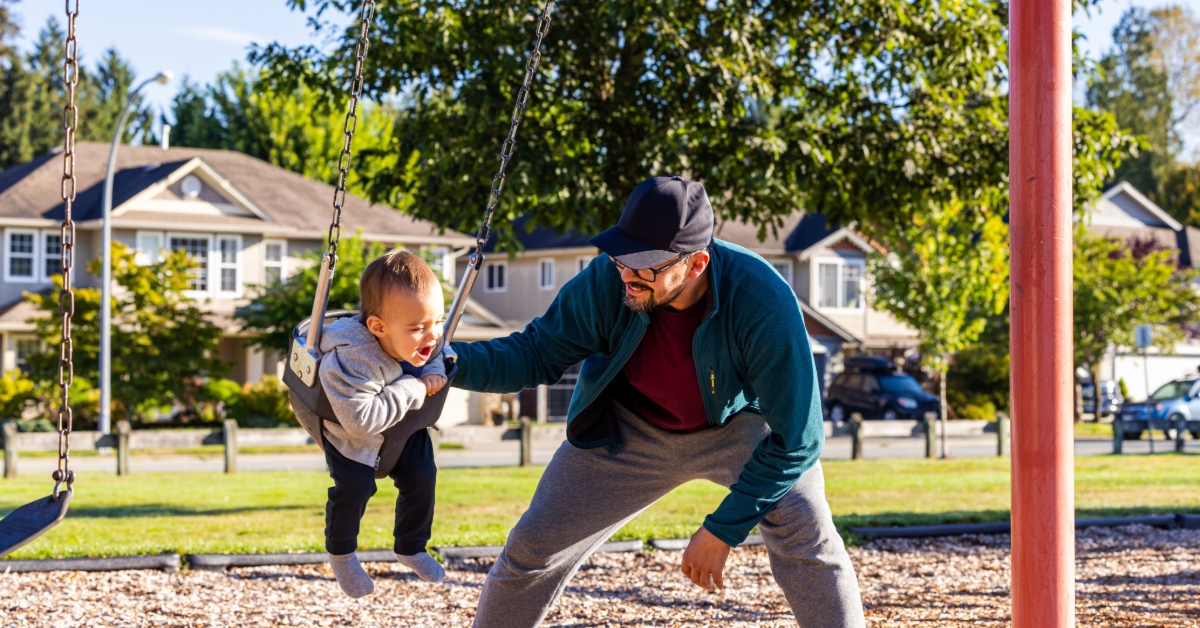 Father and Child Enjoy Outdoor Playground Fun in Mission, BC, Canada on a Sunny Day 