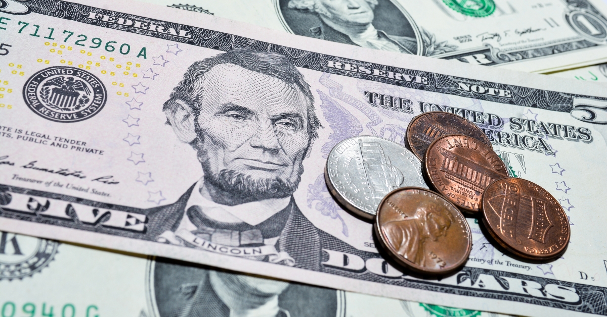 dollar bills with coins 