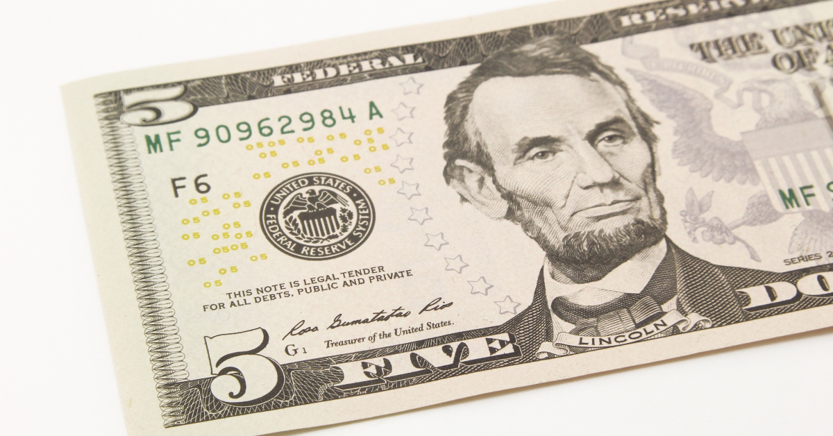 five dollar bills in cash