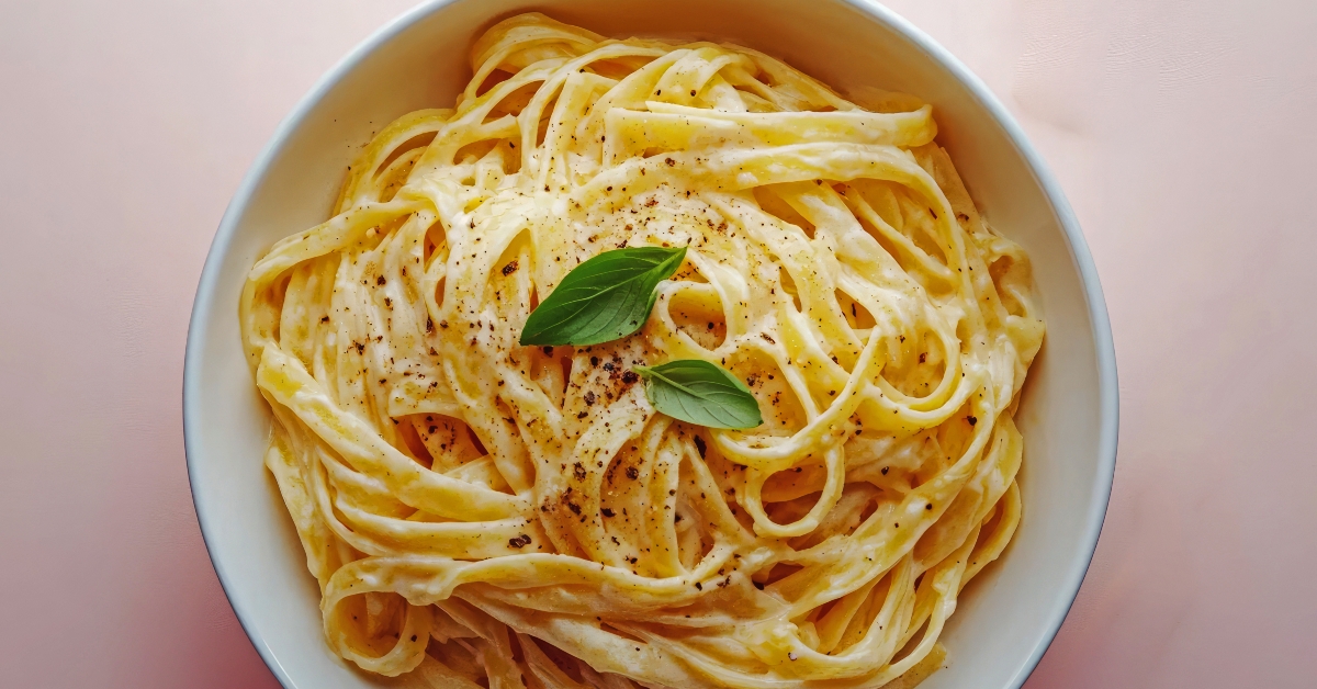 fettuccine dish garnished with basil