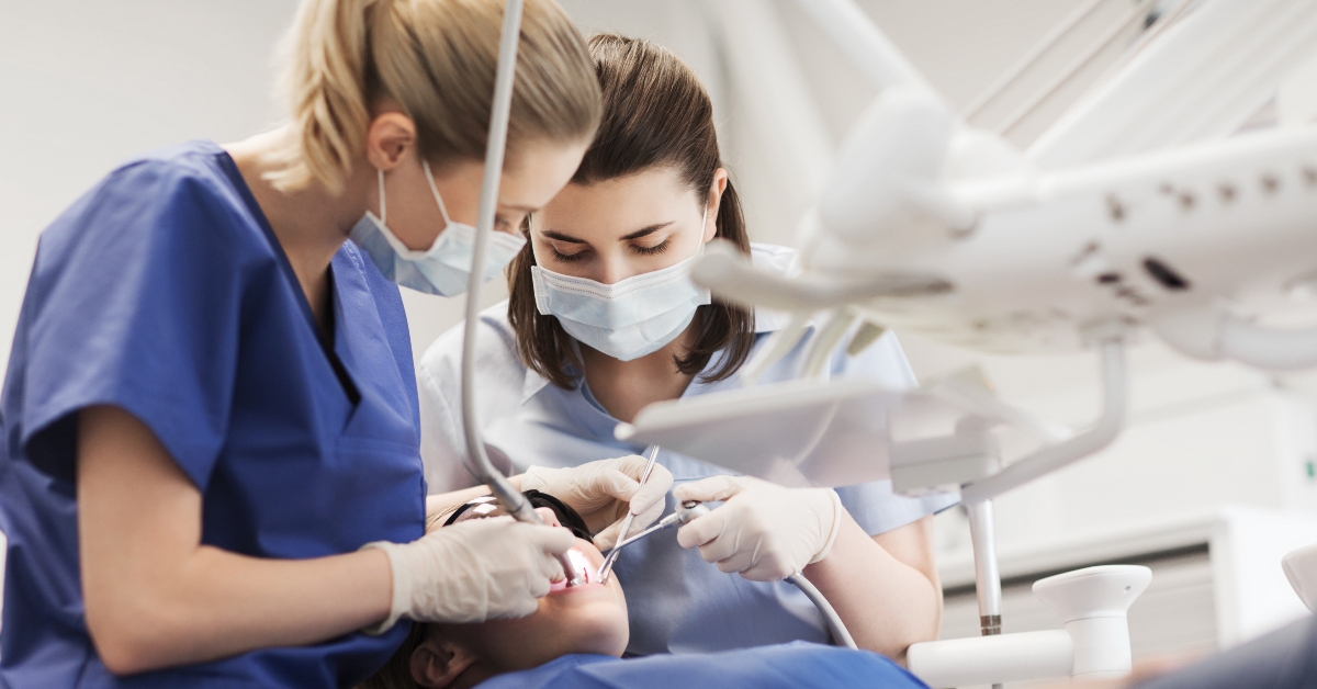 female dentists treating patient girl teeth