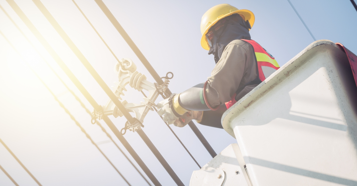 technicians perform maintenance on power lines