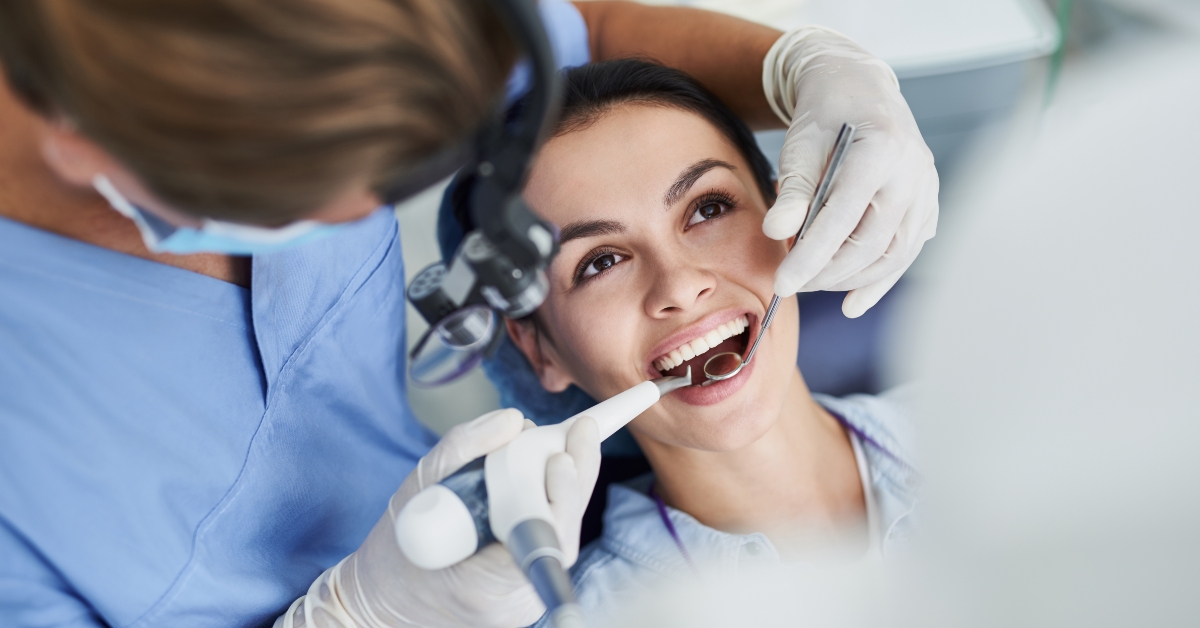 woman receiving dental treatment at clinic