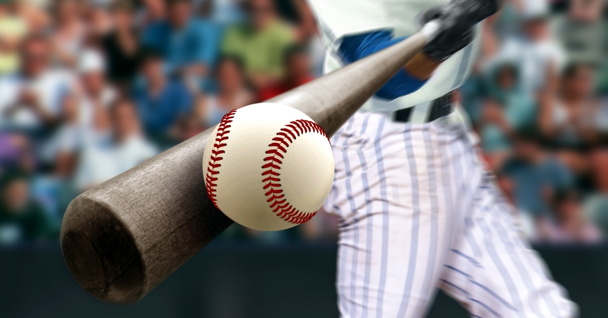 baseball player hitting ball