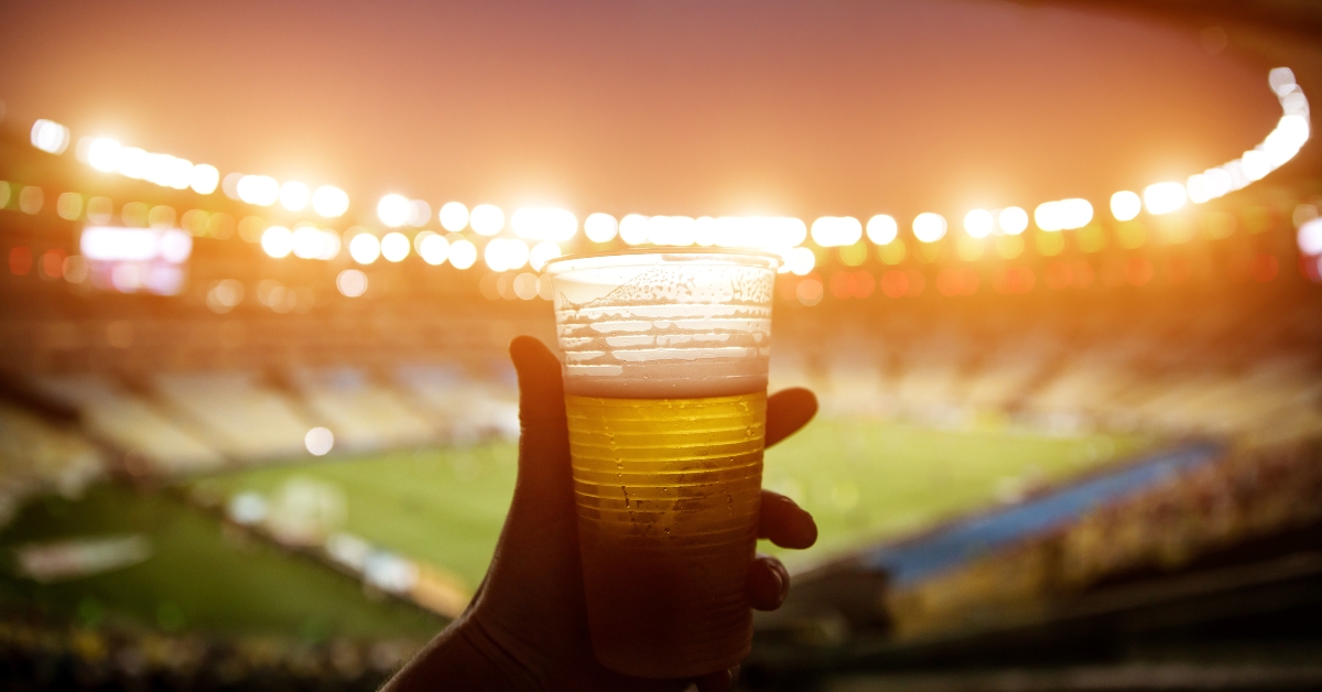 disposable glass with beer soccer