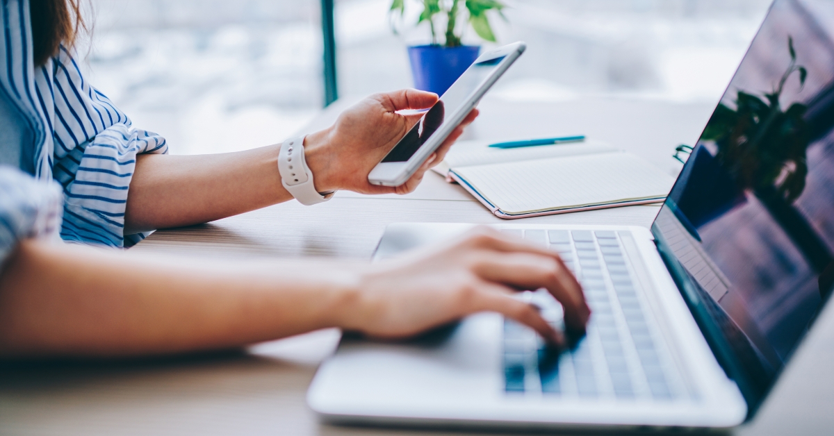 female holding smartphone getting message