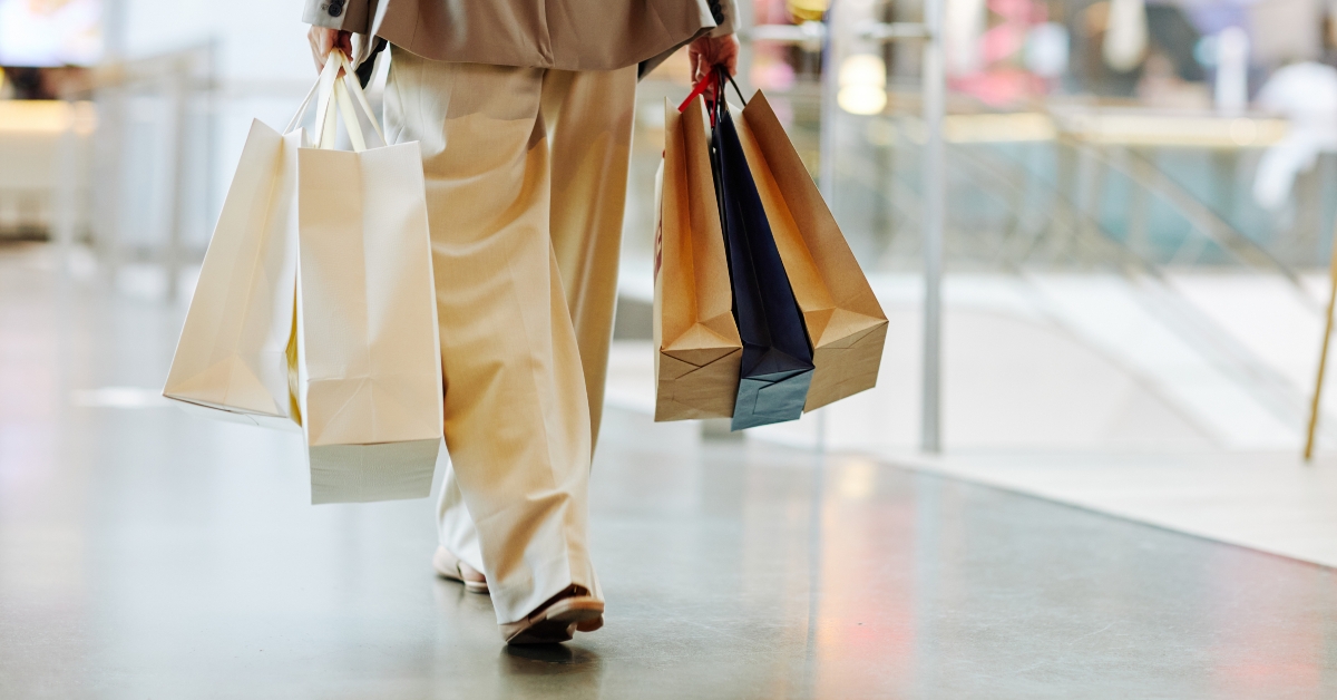 woman holding blank shopping bags
