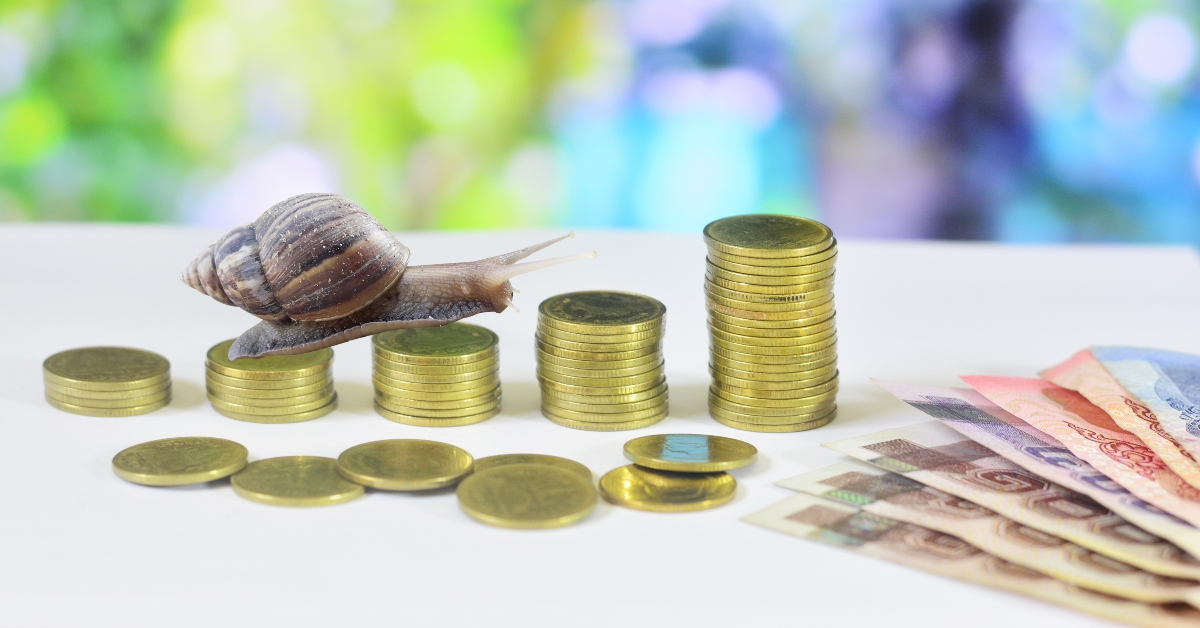 A snail crawling on a schedule of coins