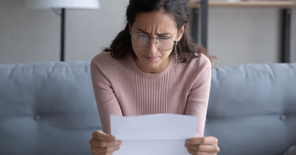 woman in glasses read post paper letter think of bad news