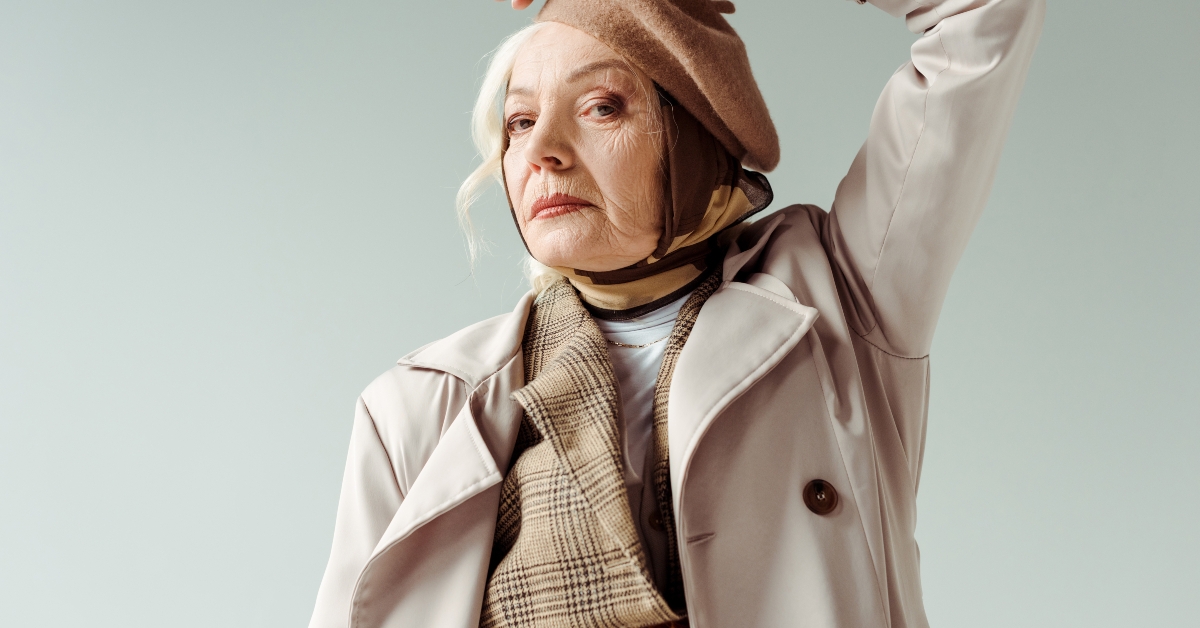 fashionable elderly woman in trench coat
