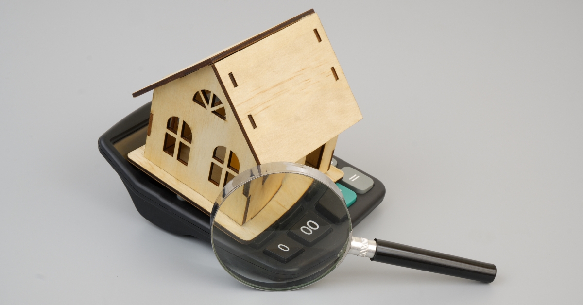 calculator and wooden house