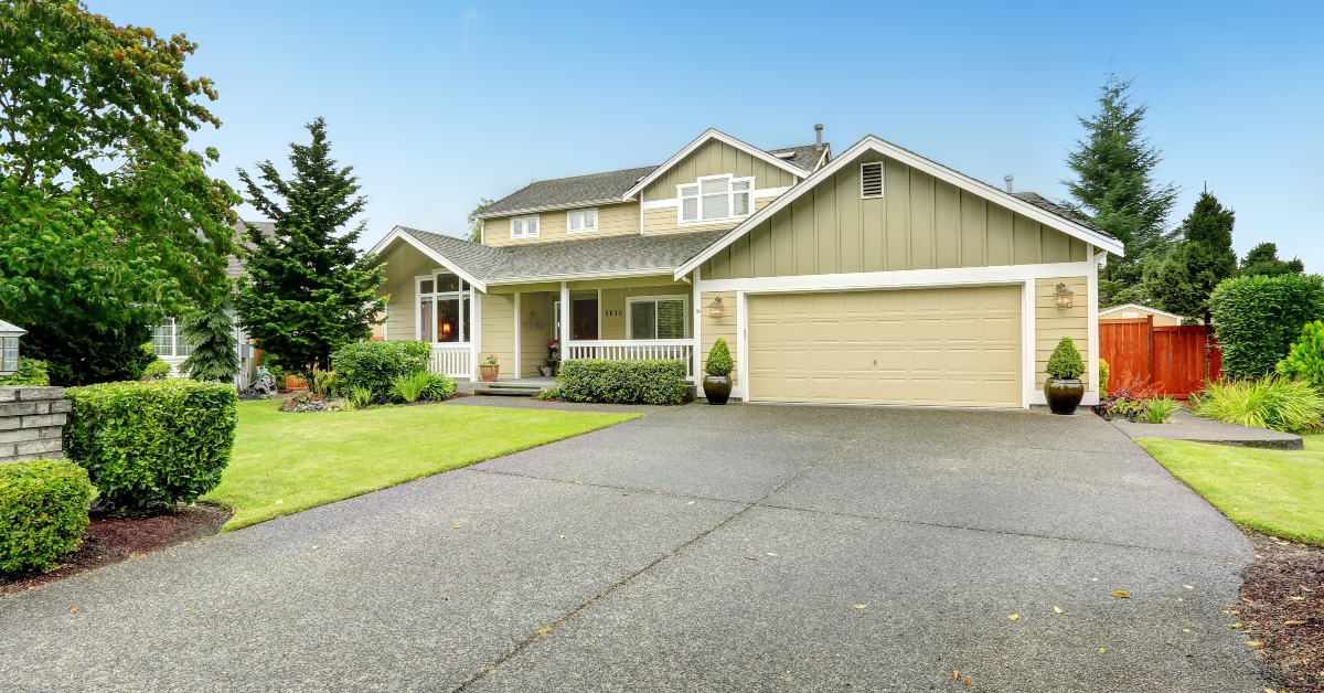 house exterior with garage and driveway 