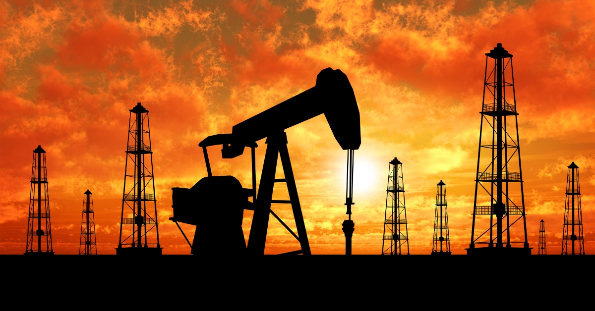 Silhouette oil rigs and pumps