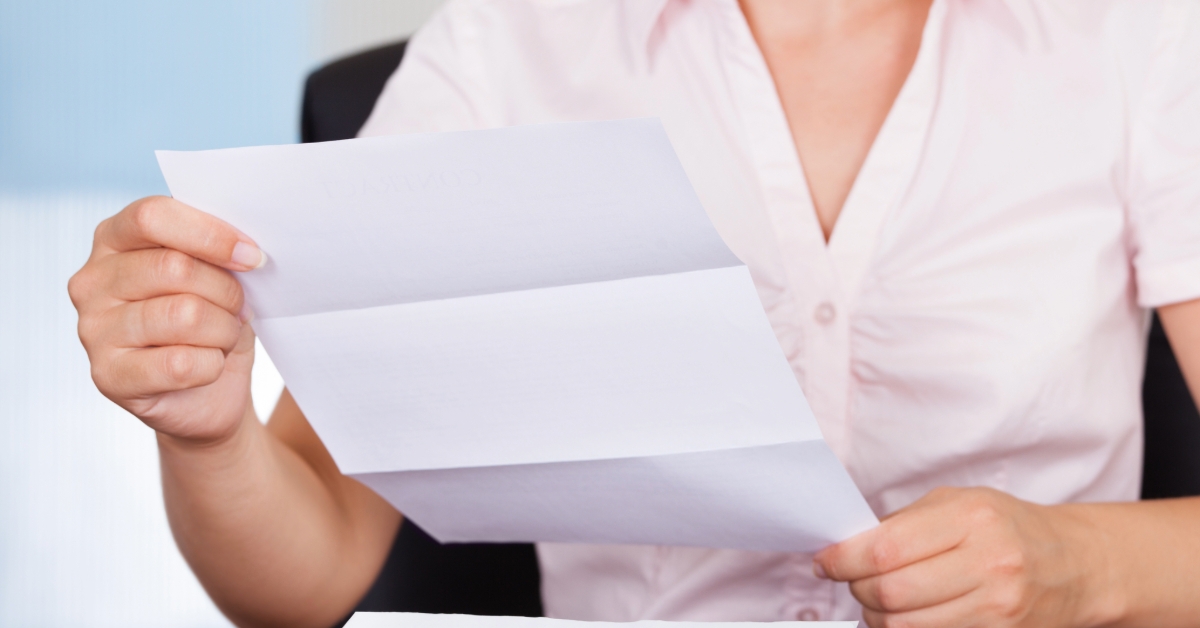Businesswoman with white envelope