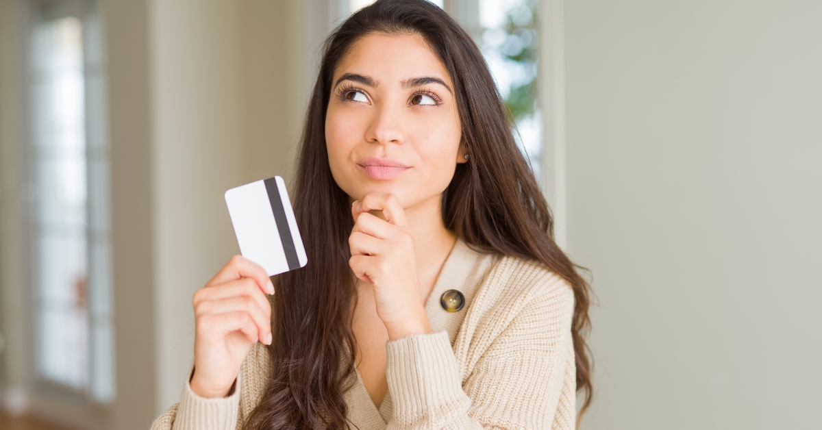 woman holding credit card 