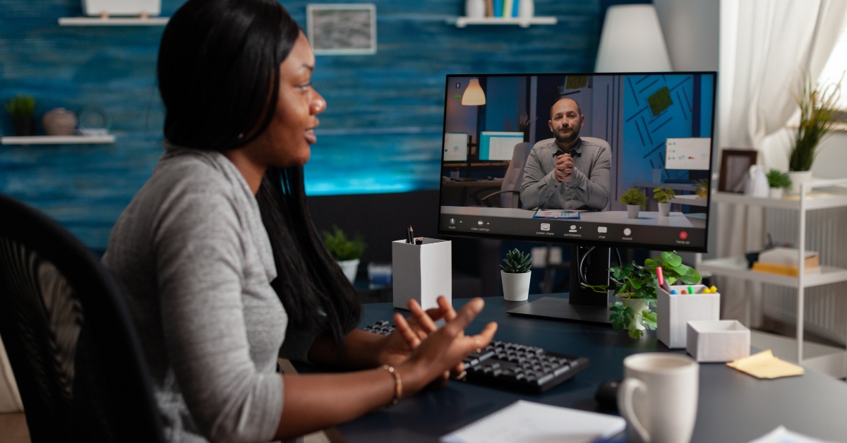 employee talking to manager on online video call 
