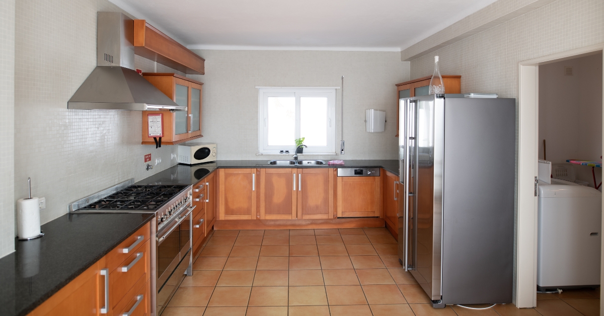 outdated kitchen with wooden cabinets