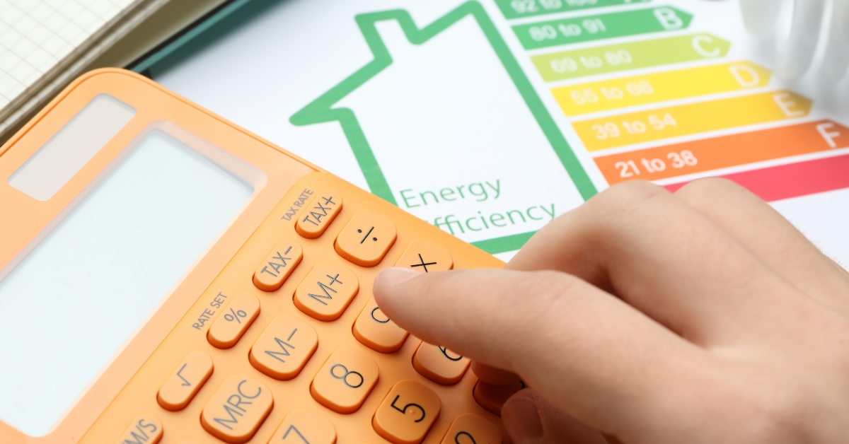 calculator and energy efficiency rating chart at table