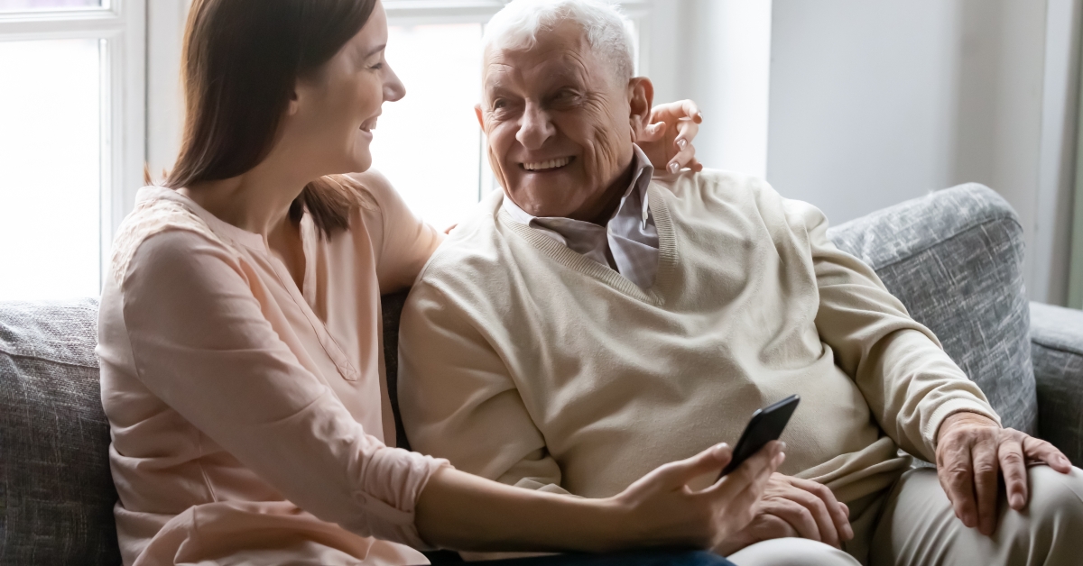 granddaughter teaching grandfather