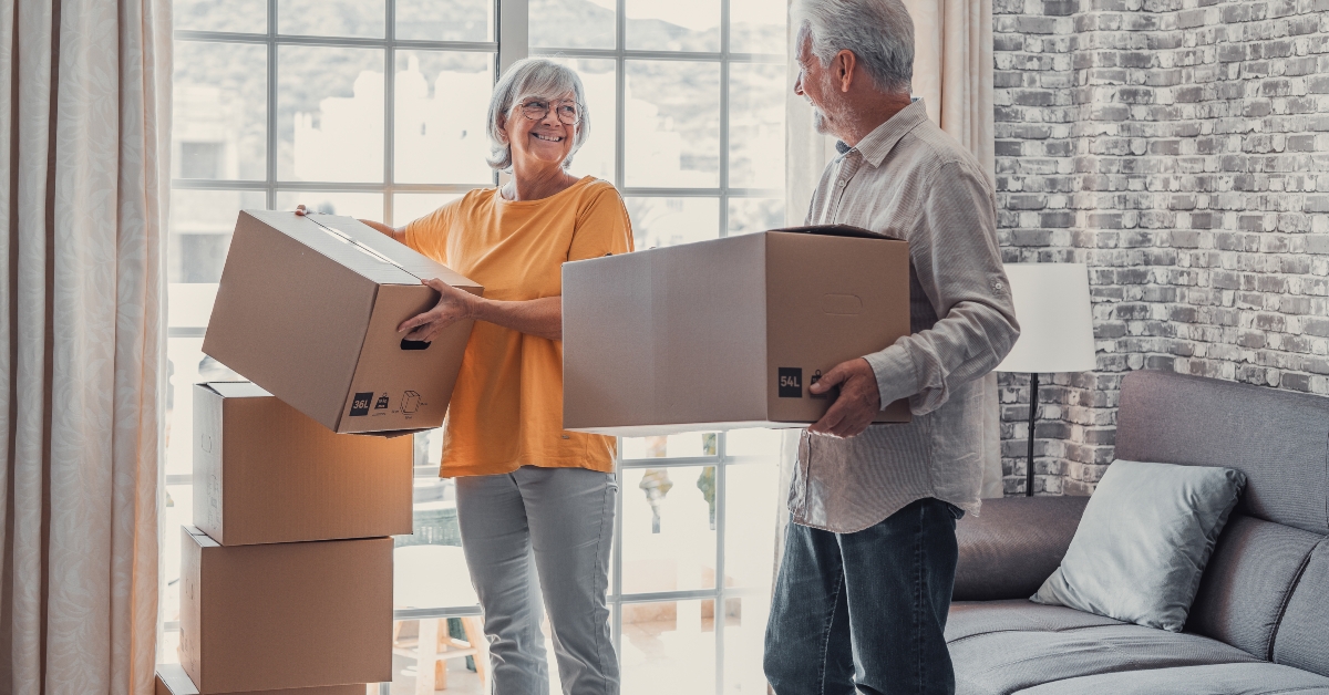 senior couple moving into new apartment