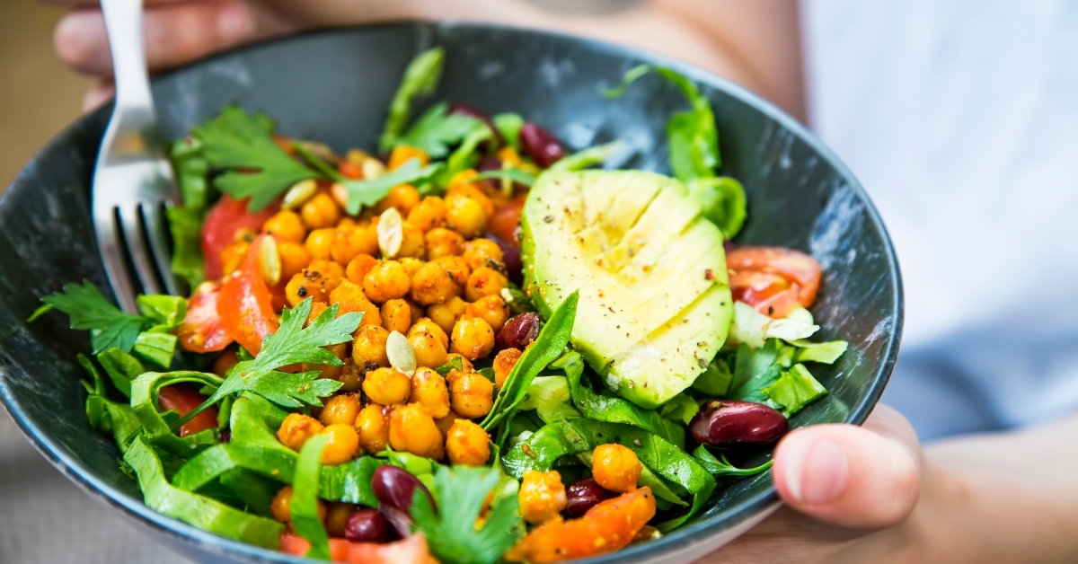 woman holding salad bowl