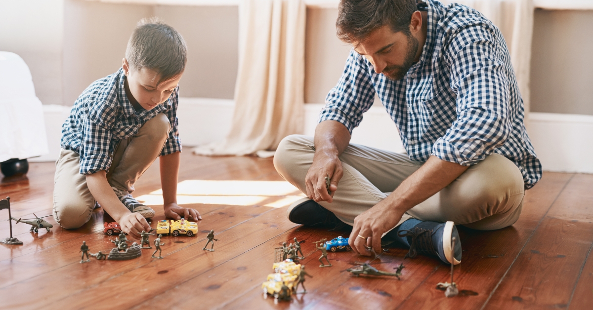 dad son and playing with toys 