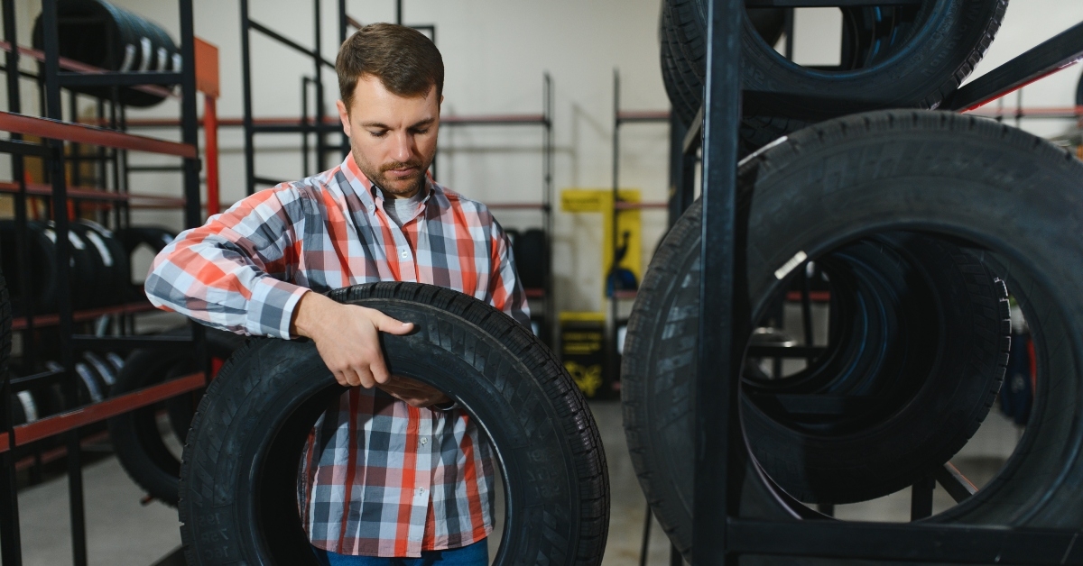 man chooses winter car tires