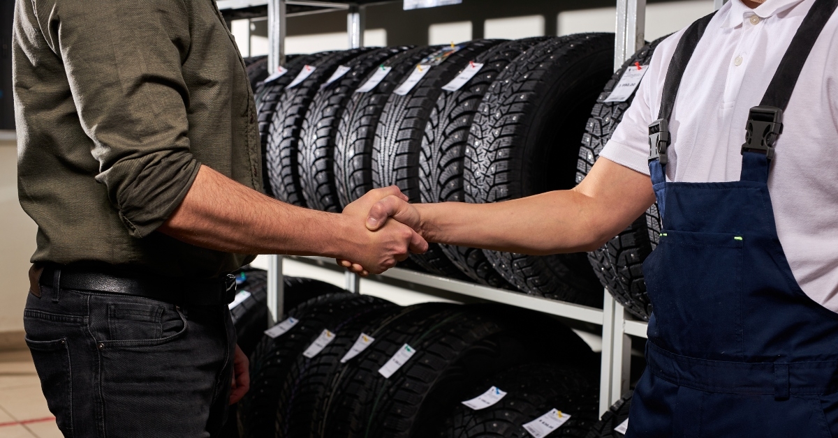 salesman and customer shaking hands