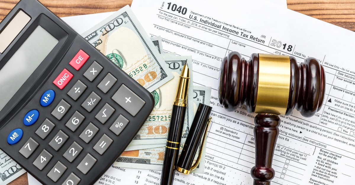 Gavel with calculator and money