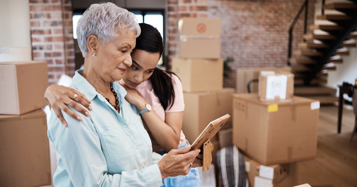 shot of a senior women looking at a photograph