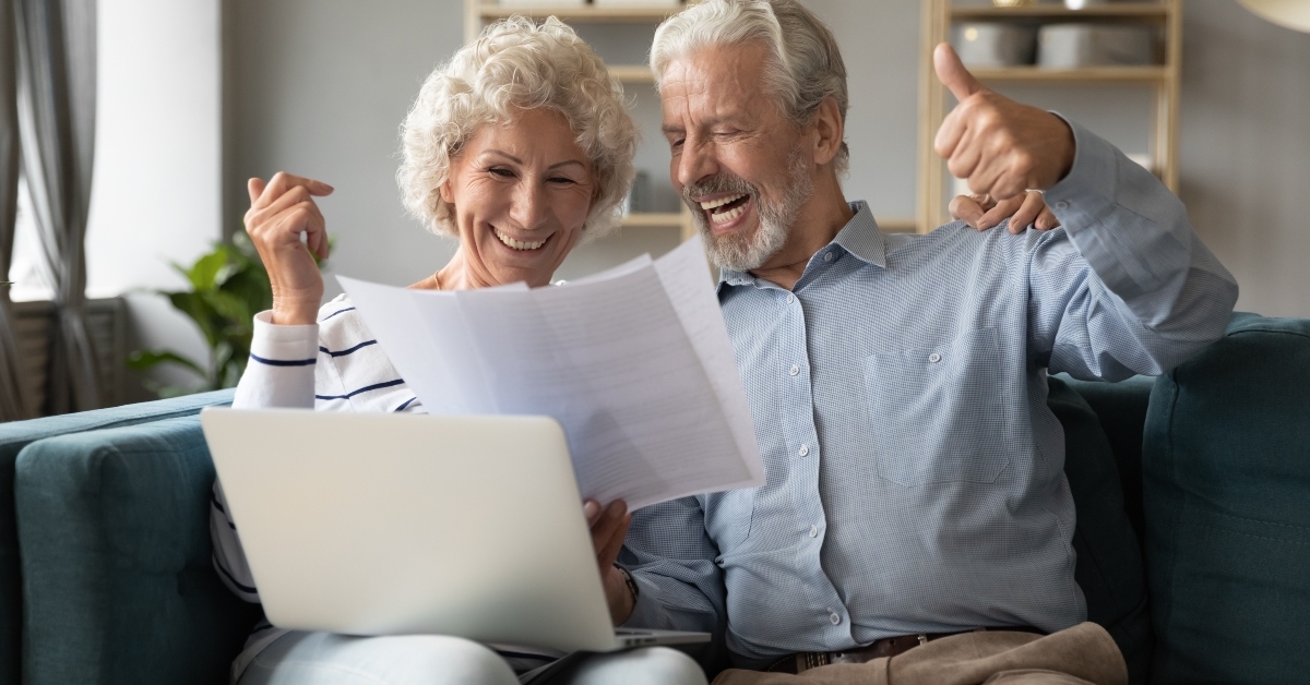 spouses check documents feels happy about pay debt off