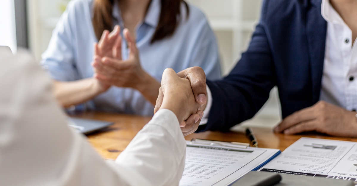 managers and job applicants shake hands