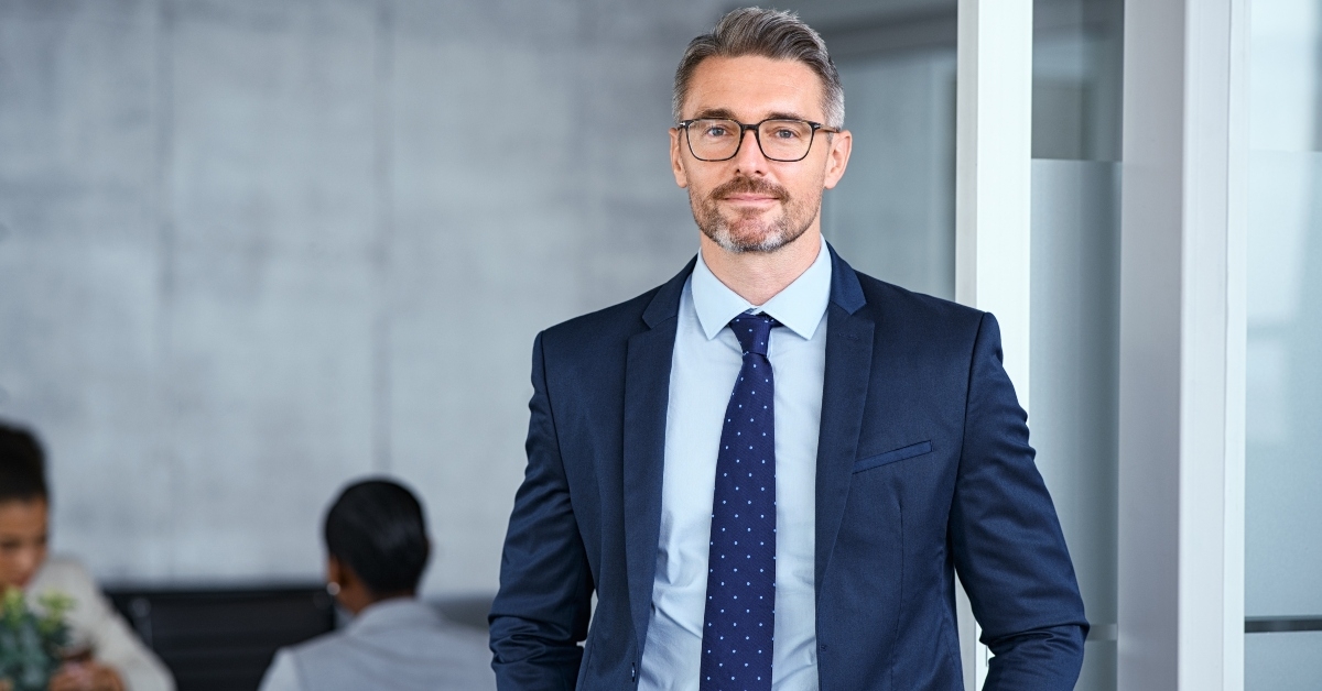 mature businessman looking at camera