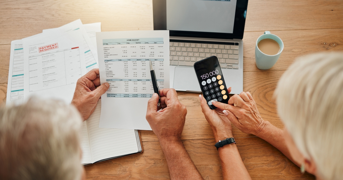 senior couple calculating their expenses