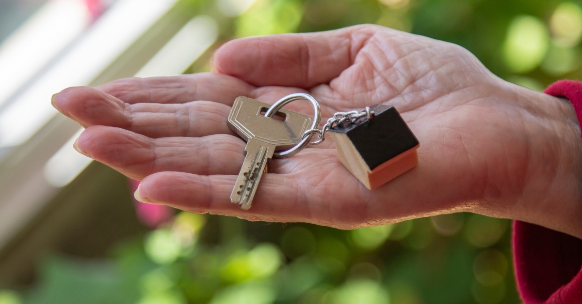 woman showing new house keys 