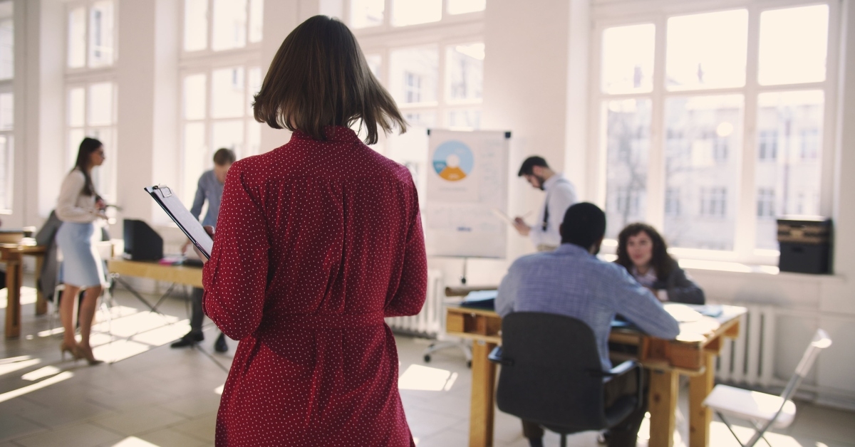 assistant entering large trendy loft office