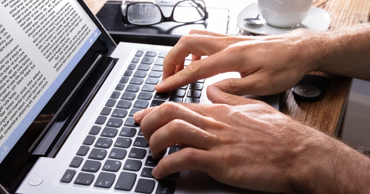 person typing on laptop