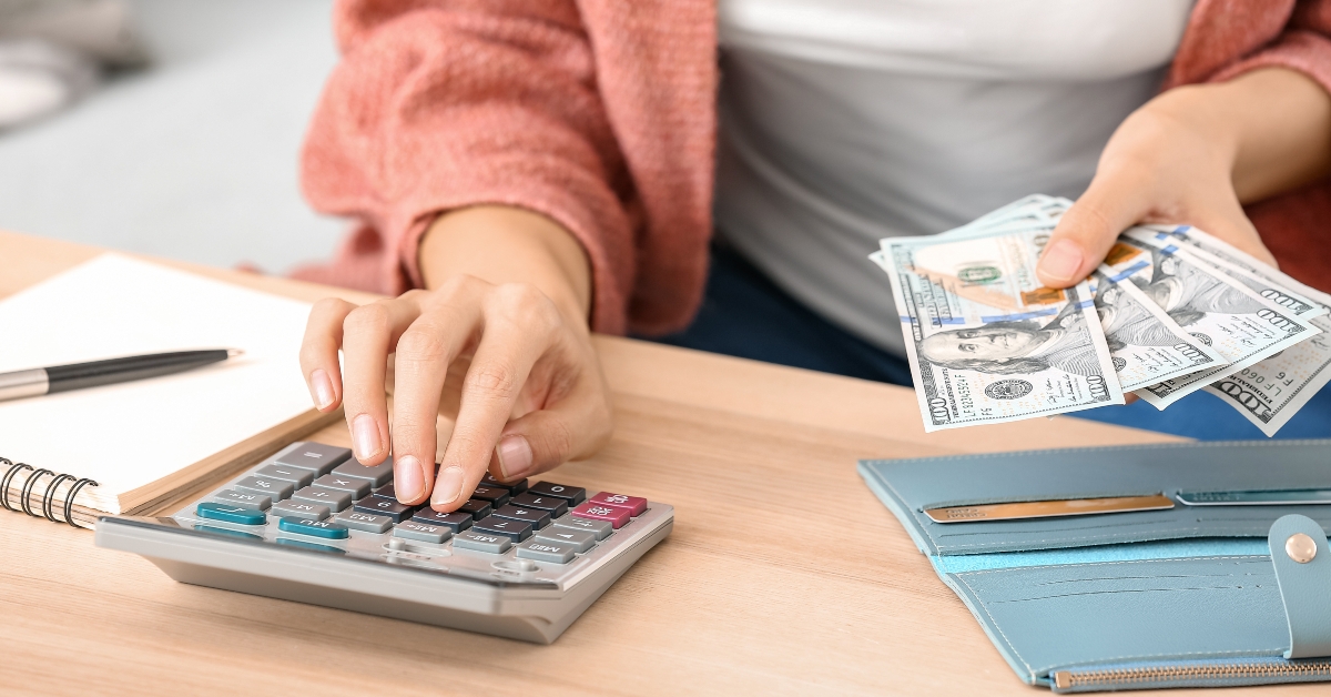 woman counting money at home