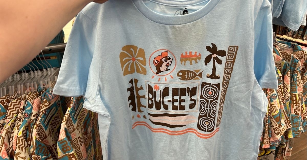 person holding a blue crop top