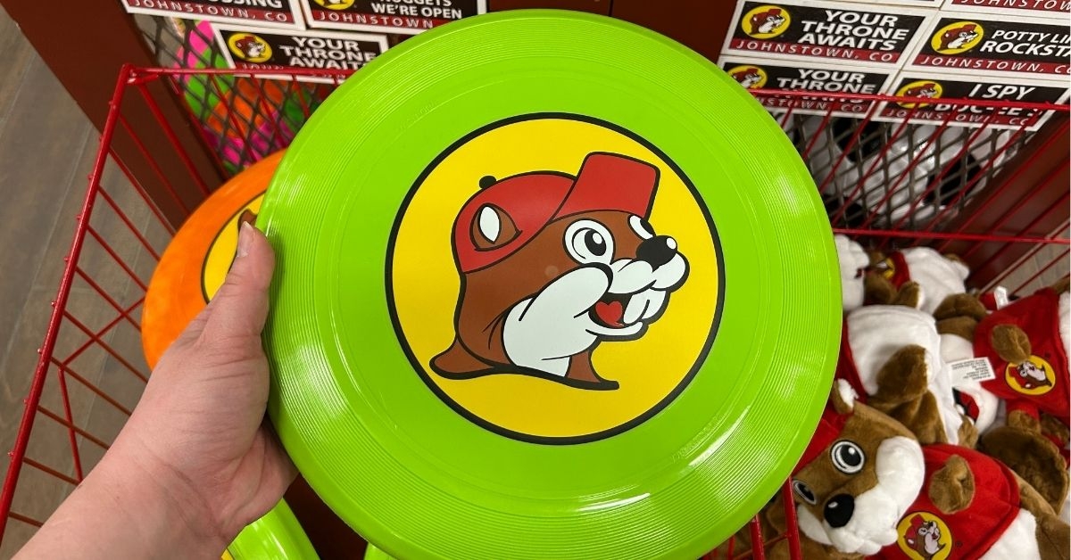 person holding a green frisbee