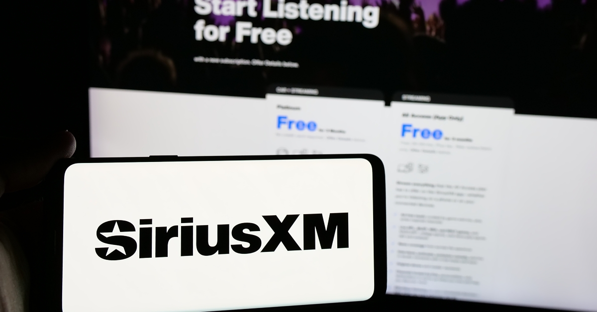 Person holding smartphone with logo of US broadcasting company