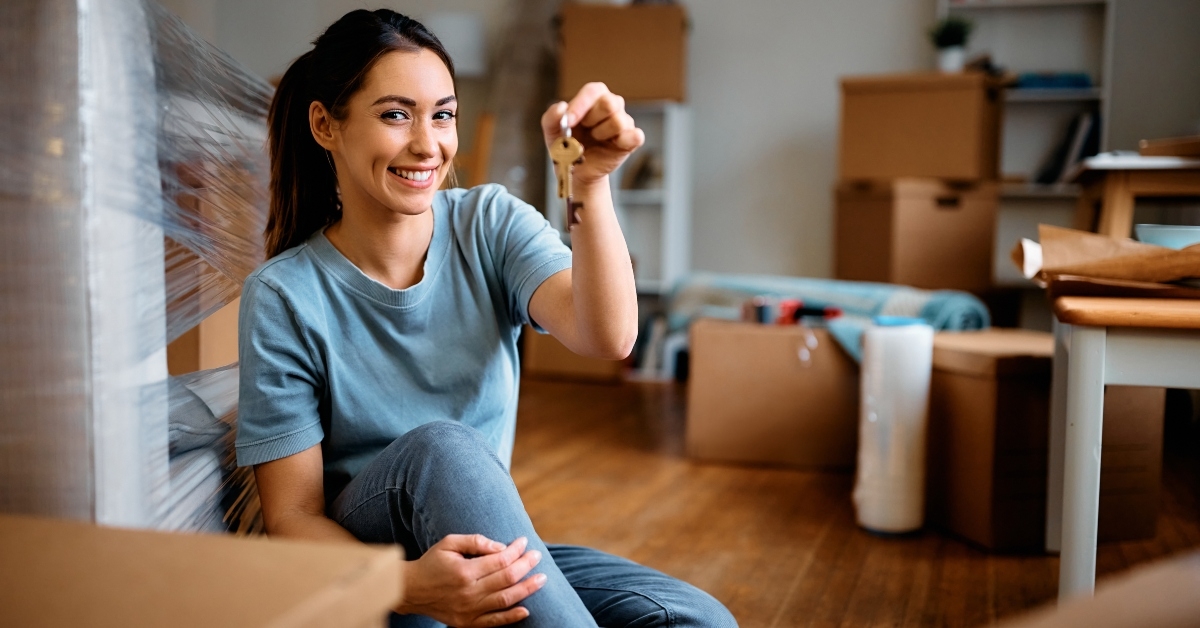 young happy woman key