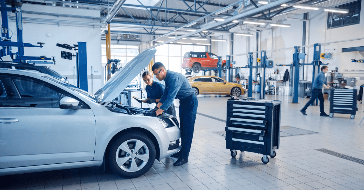 mechanics working on car