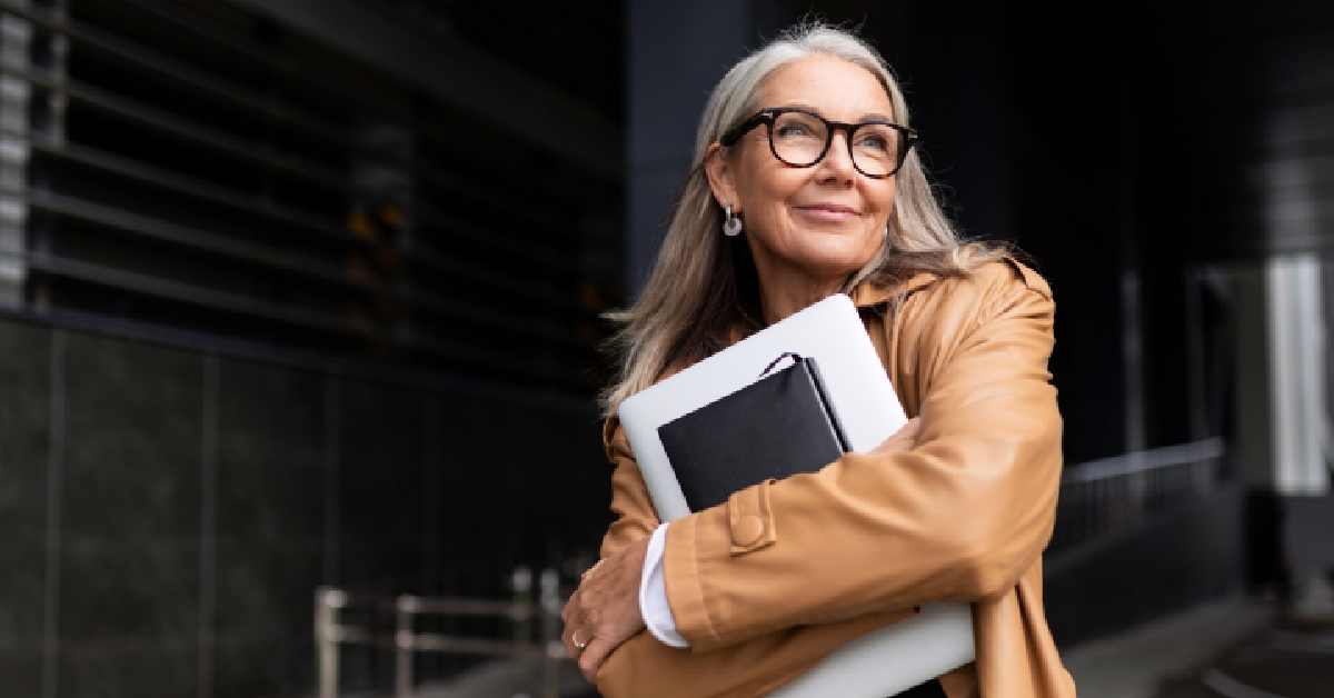 elderly businesswoman with a laptop